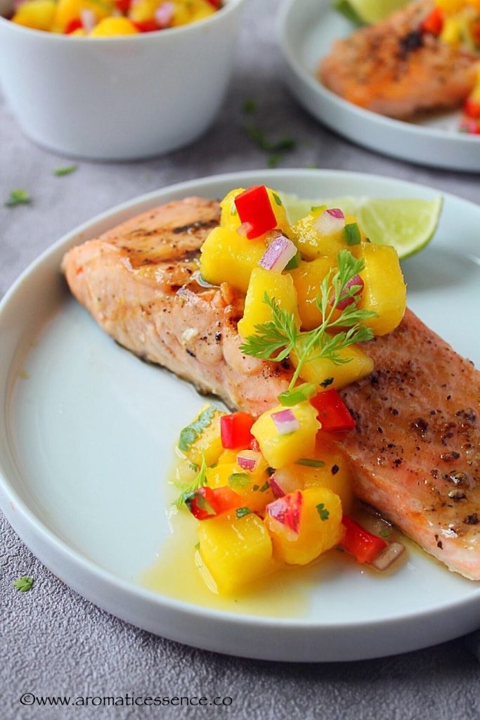 Salmon With Mango Salsa Recipe – Grilled Salmon Topped With Fresh Mango Salsa.